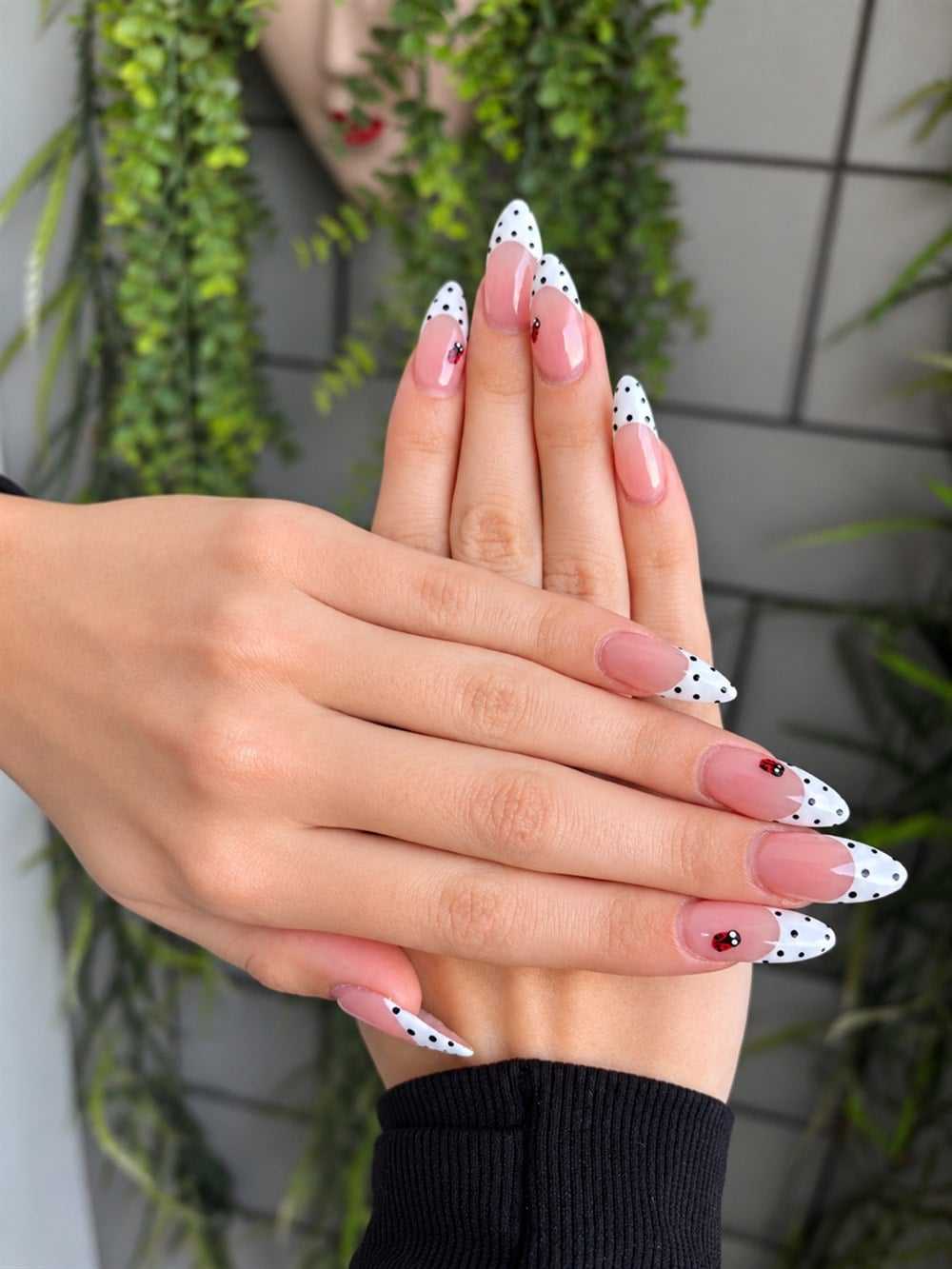 Nails by Cassie: white French tip almond nails with black dots and ladybug accents