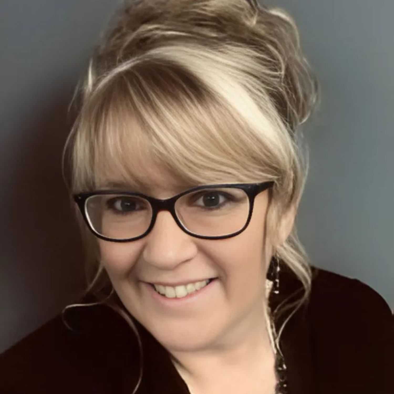 Portrait of Carol, a professional stylist at Head over Heels Salon, showcasing their expertise and style.