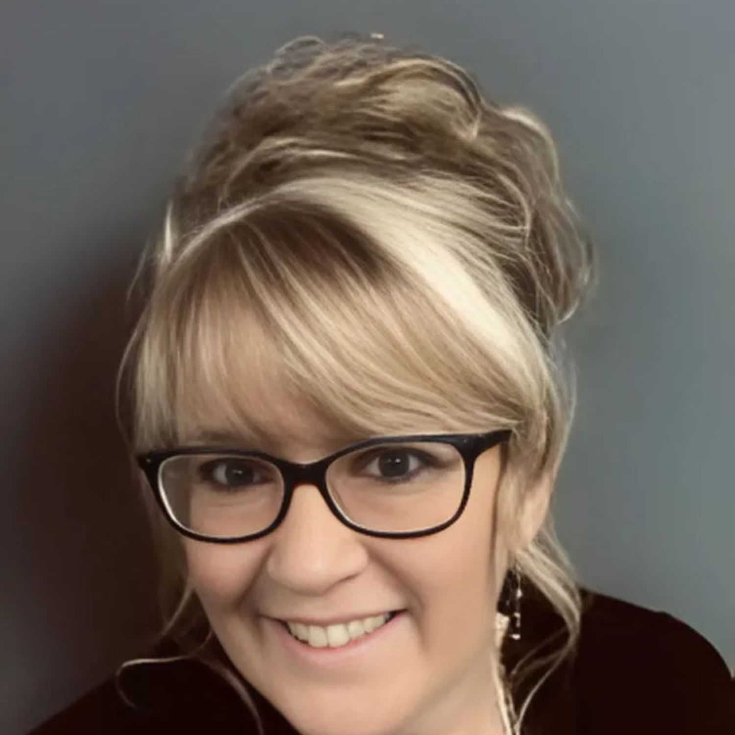 Portrait of Carol, a professional stylist at Head over Heels Salon, showcasing their expertise and style.