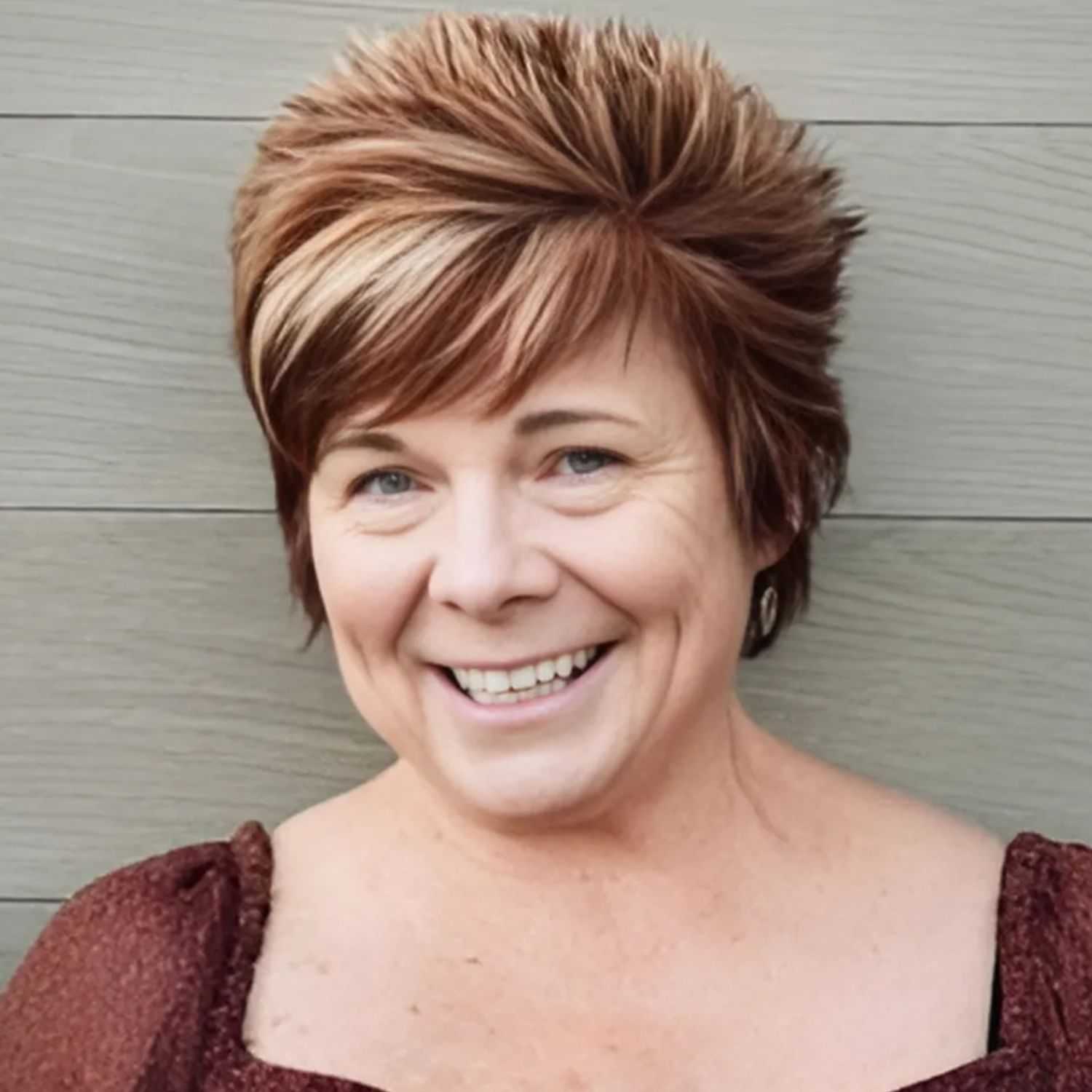 Portrait of Denise, a professional stylist at Head over Heels Salon, showcasing their expertise and style.