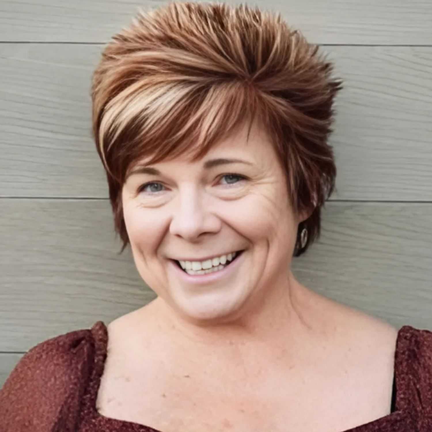 Portrait of Denise, a professional stylist at Head over Heels Salon, showcasing their expertise and style.