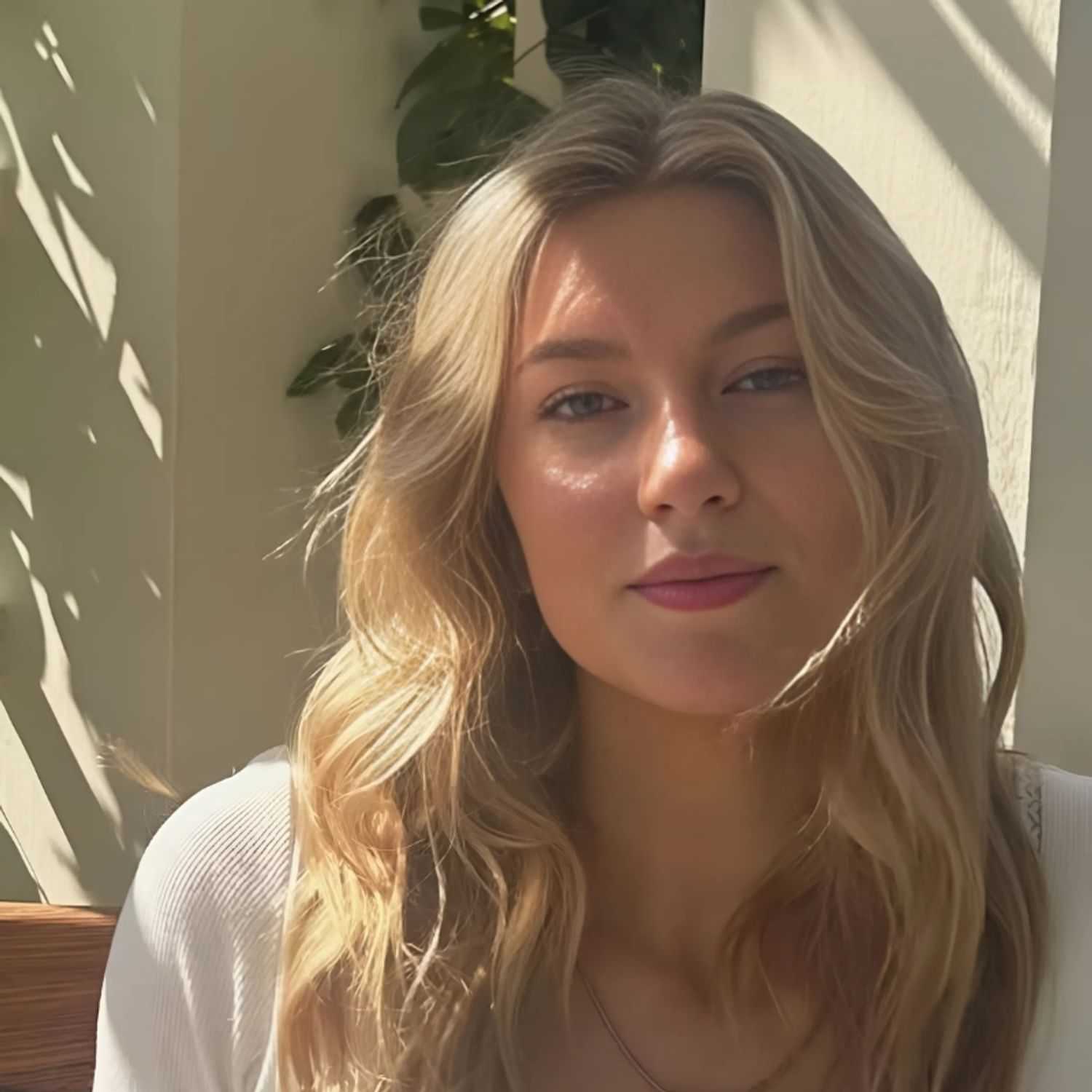 Portrait of Kylie, a professional stylist at Head over Heels Salon, showcasing their expertise and style.