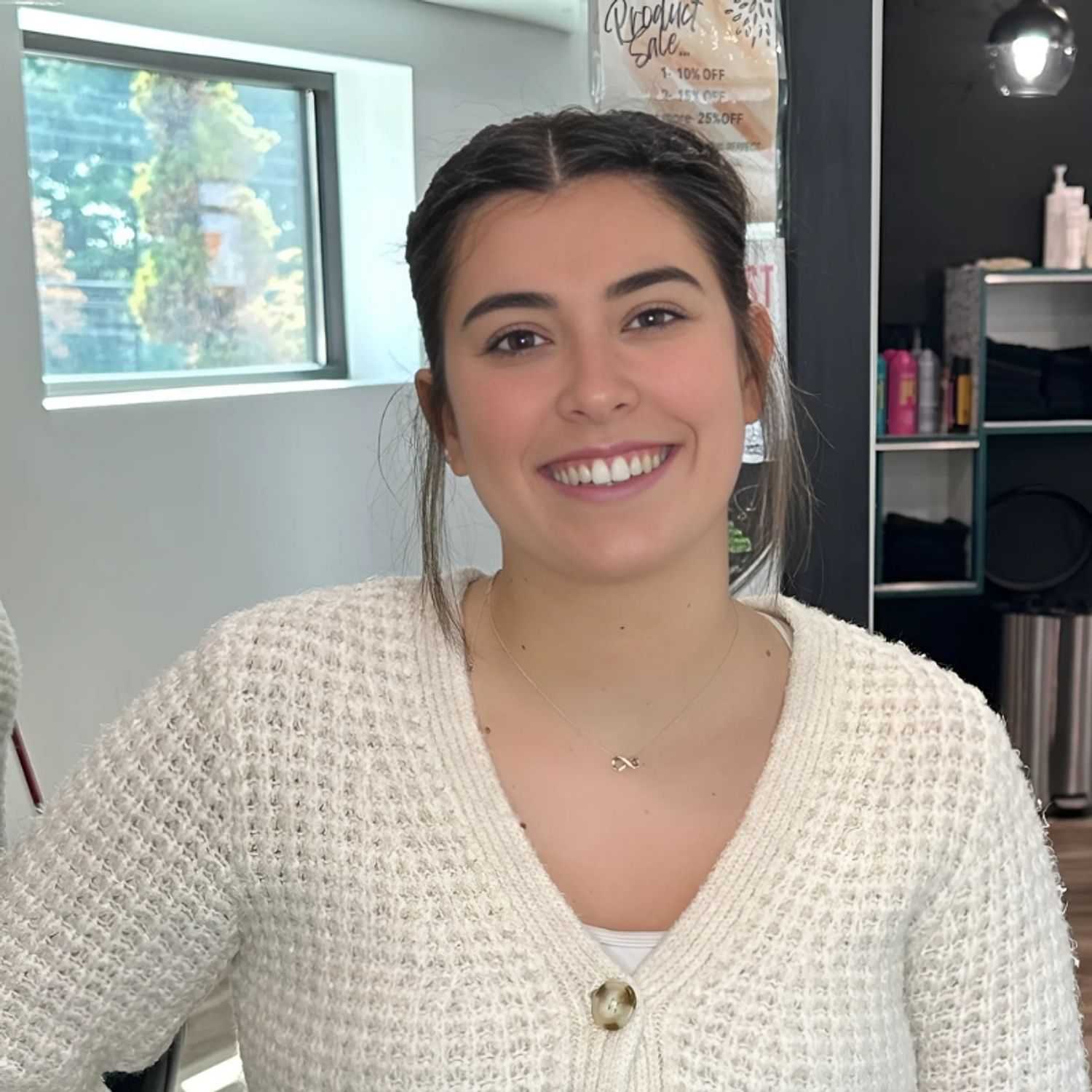 Portrait of Paige, a professional stylist at Head over Heels Salon, showcasing their expertise and style.
