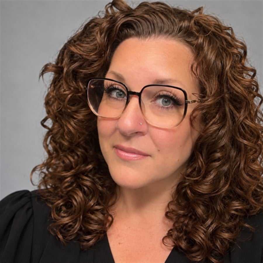 Portrait of Tina, a professional stylist at Head over Heels Salon, showcasing their expertise and style.
