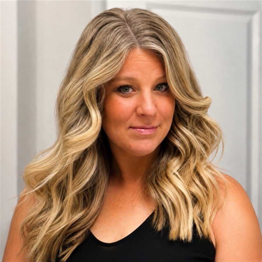 Portrait of Lauren, a professional stylist at Head over Heels Salon, showcasing their expertise and style.