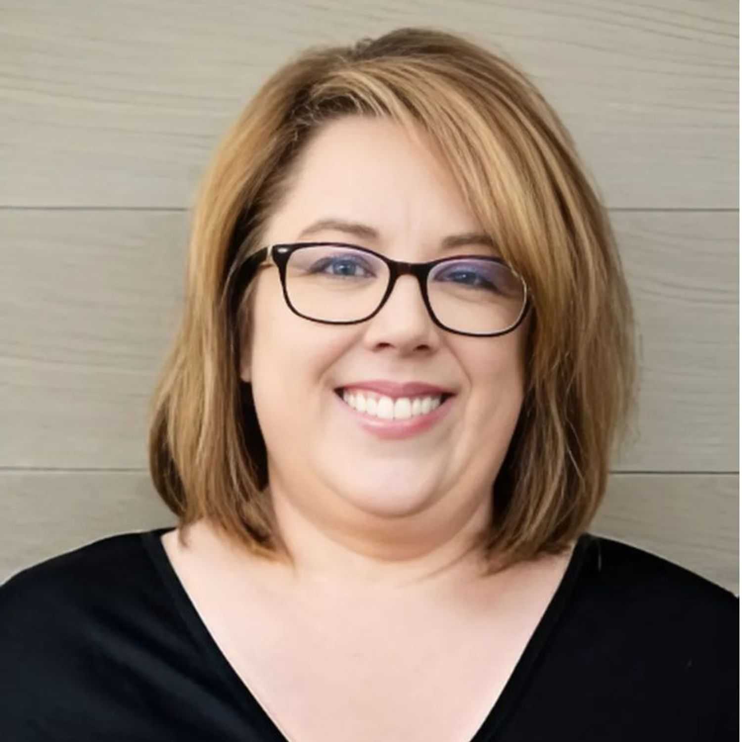 Portrait of Jen, a professional stylist at Head over Heels Salon, showcasing their expertise and style.